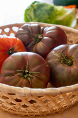 New harvest of big raddish-purple heirloom tomatoes Black Crimea