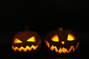 Glowing Halloween Pumpkins isolated on black background