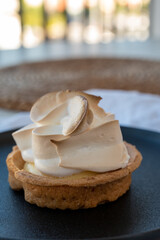 One piece of lemon tart with white eggs meringue