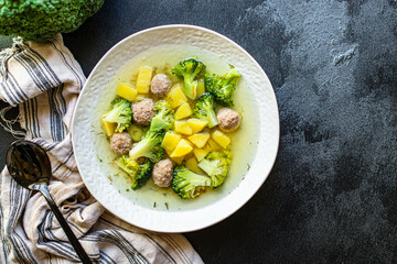 soup meatballs, broccoli and vegetables first course meat broth top view copy space for text food background rustic keto or paleo diet