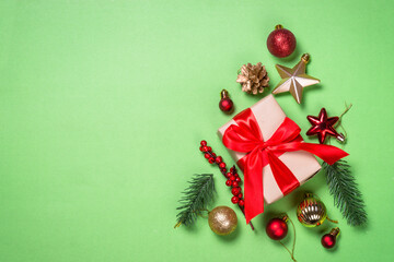 Fototapeta na wymiar Christmas flat lay background with fir tree and decorations.