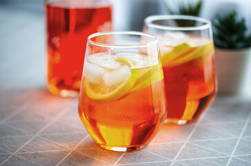 colorful orange color wine cocktails in beautiful glass on the table at home, afternoon drinks at home, an after-work drink