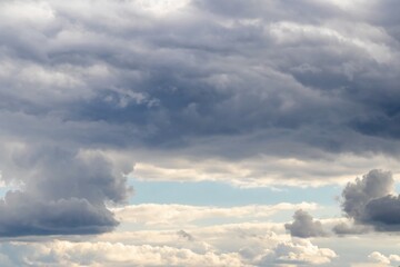 Fototapeta na wymiar Dramatic sky with thick dark clouds and gradient gray, skylights