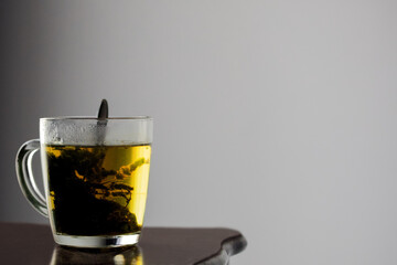 A cup of warm tea made with fresh mint 