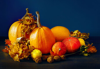 Naklejka na ściany i meble Pumpkins and autumn leaves