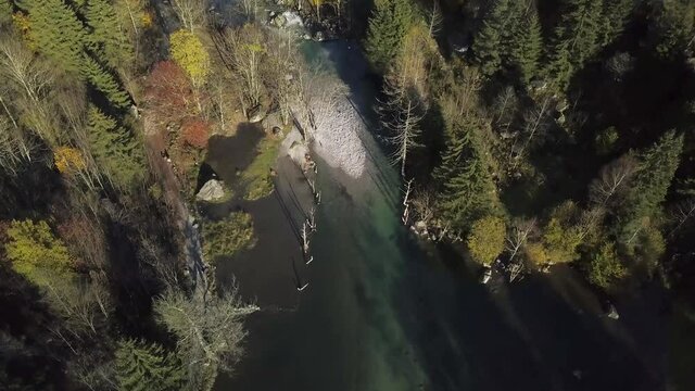 aerial view of small lake and multicolor woods, in autumn season lake in Val di Mello, Val Masino , Italy - lombardy.