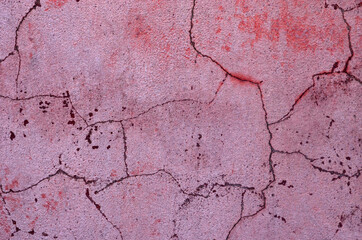Pink wall. Cracks. Concrete texture. Background.