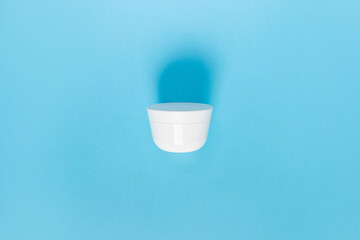 Jar for liquid, cream, gel, lotion. Сosmetic jar on blue background. SPA cosmetic product branding...