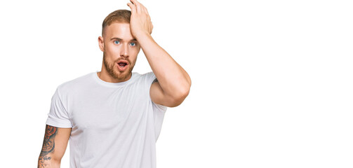 Young irish man wearing casual clothes surprised with hand on head for mistake, remember error. forgot, bad memory concept.