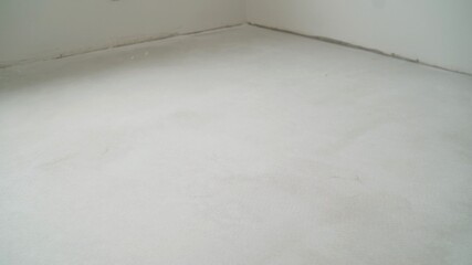 Floor leveling works. Fresh concrete floor of a construction site.