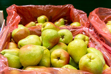 Pears harvest background on shelves in supermarket may use as background close up