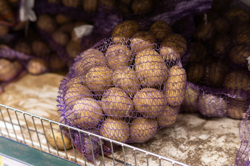 Fresh organic young potatoes sold in the market. Traditional bazaar.Trade in farm products....