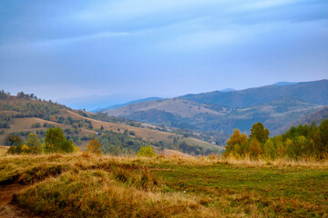 Colorful autumn landscape in the Romanian Carpathians, Fantanele village, Sibiu county, Cindrel mountains, 1100m, Romania