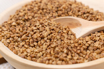 Buckwheat grain dry buckwheat. Close-up of brown buckwheat groats. Healthy food.