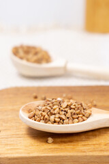 buckwheat macro view on rustic background. gluten free ancient grain for healthy diet. vertical photo