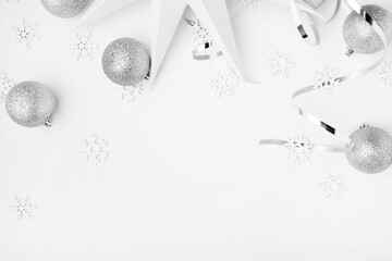 New Years party remnants with silver tones on a white elegant background
