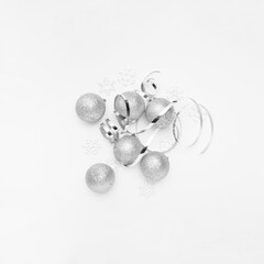 New Years party remnants with silver tones on a white elegant background