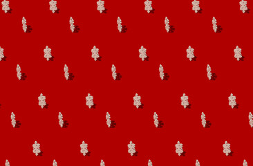wooden snowflakes pattern on red background
