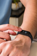 Fototapeta premium watching the time on a smart band.