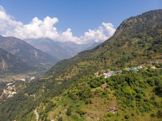 Naklejka na ściany i meble Aerial landscape in the mountains. Bird eye view taken through a drone