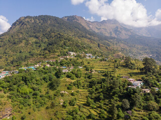 Naklejka na ściany i meble Aerial landscape in the mountains. Bird eye view taken through a drone