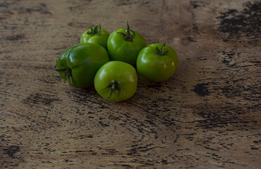 Green unripe tomatoes. Top view.