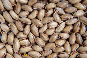 Background of pistachio nuts. Flat layout. Nuts close up