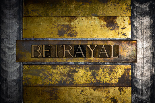 Betrayal text message on textured grunge copper and vintage gold background