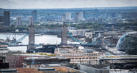 City of London view, business and office area, river Thames and London bridges with traffic.