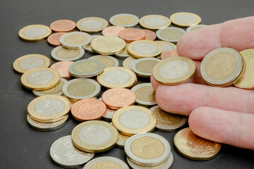 Different argentine coins stacked. Pile of money. Metal coins texture. Financial world background.