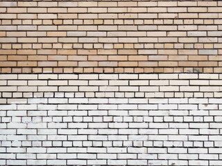 Three different colors brickwork. Urban city brick wall with sloppy white color paint smudge. Background or backdrop for web design or banner with copy space.
