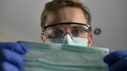 Doctor Putting Surgical Mask on Coronavirus Patient's Face POV