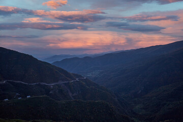Fototapeta na wymiar Beautiful mountain landscape at sunset, mountainous Dagestan. Serpentine road