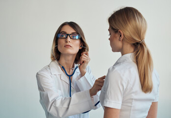 Woman professional doctor with glasses stethoscope patient health