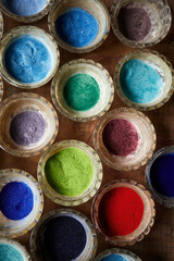Powder pigment for making cloisonne enamel. Various colors in bowls