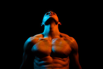 Muscular man body and strong shoulder muscles. Sexy gay isolated on black.