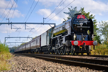 Obraz premium express steam train on modern railway