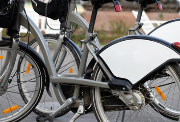 Fototapeta na wymiar Bicycle rental station on public parking in the city