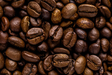 Fresh roasted coffee bean background. Background of roasted coffee beans, top view