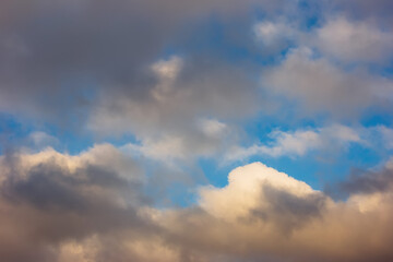Blue sky with white and gray clouds.