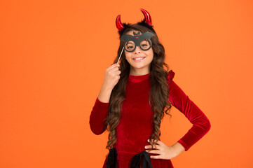 happy halloween. kid wear devil horns. child with funny party attribute. teen girl has long curly hair and wear dress for holiday celebration. autumn season holidays. childhood leisure. copy space