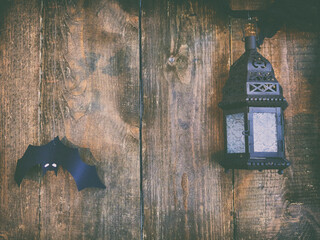 background for the mystical holiday Halloween. Religious beliefs. Decorative bat on wooden background