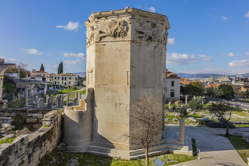 Fototapeta na wymiar Tower of the Winds (2nd century BC) - octagonal Pentelic marble clock tower in Roman Agora built in Athens during the Roman period. Athens, Greece.