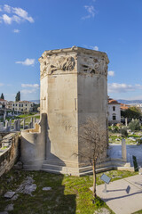 Fototapeta na wymiar Tower of the Winds (2nd century BC) - octagonal Pentelic marble clock tower in Roman Agora built in Athens during the Roman period. Athens, Greece.