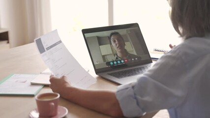 Senior woman recruiter talking to seeker during social distance job interview by video call. Elderly hr hiring female applicant communicating in conference virtual chat videocall meeting on laptop.