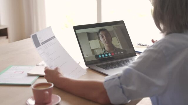 Senior woman recruiter talking to seeker during social distance job interview by video call. Elderly hr hiring female applicant communicating in conference virtual chat videocall meeting on laptop.