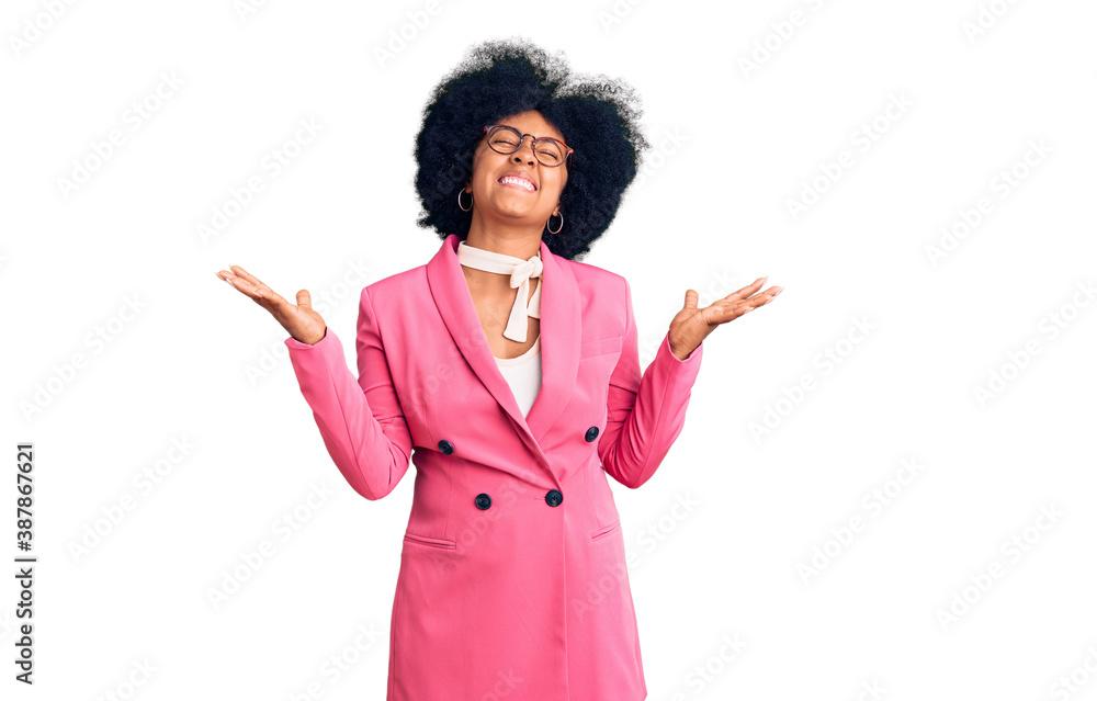 Sticker Young african american girl wearing business clothes and glasses celebrating mad and crazy for success with arms raised and closed eyes screaming excited. winner concept