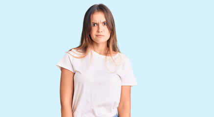 Obraz premium Beautiful caucasian woman wearing casual white tshirt skeptic and nervous, frowning upset because of problem. negative person.