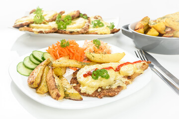 cutlet with pineapple and  baked potatoes with bouquet of salads