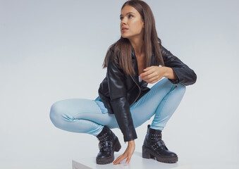 Focused fashion model looking away, wearing leather jacket © Viorel Sima